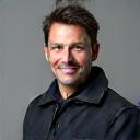 Portrait of Jack Reynolds, a rider in his 40s with a confident smile.